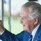 Former Australian Prime Minister Bob Hawke finishes a cold beer while watching a cricket match in 2018.